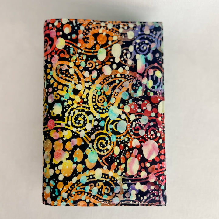 rectangular fabric book cover with rich paisley multicolored splatters and colors