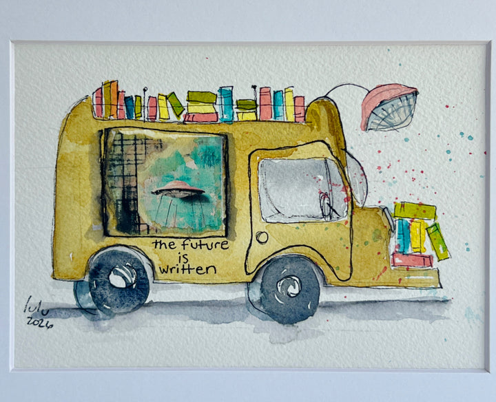 A matted watercolor painting of a mustard-yellow sci-fi book truck carrying colorful books, with the text 'the future is written' on the side, shown against a white mat and light wall background.