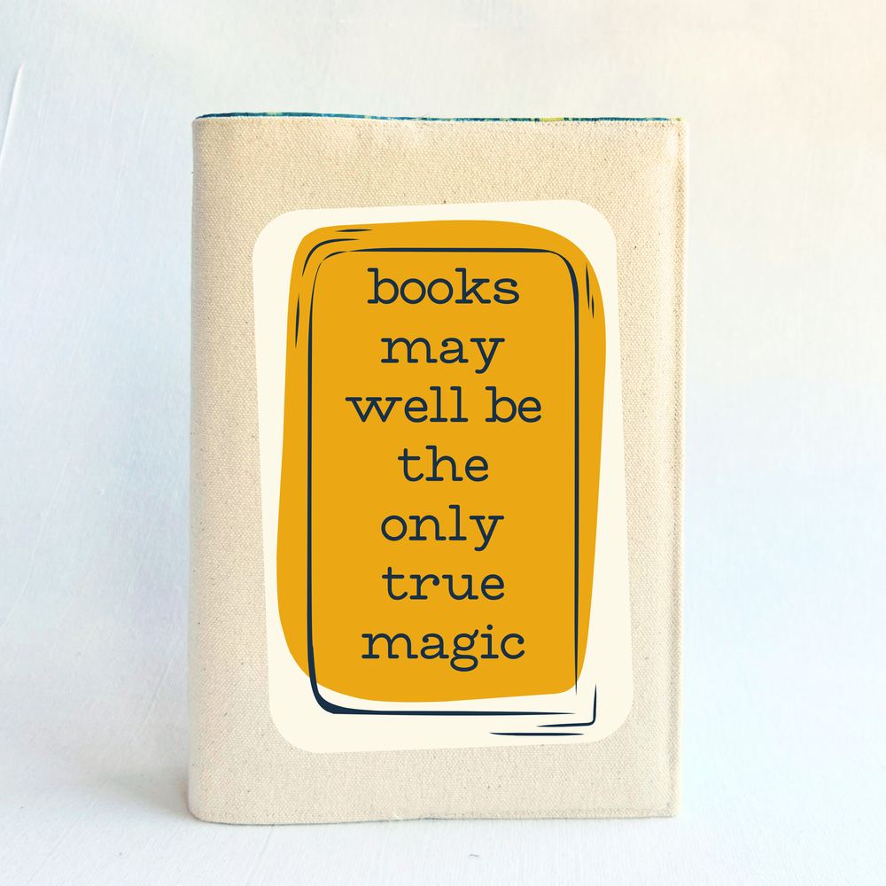 a book covering in linen-colored canvas fabric, with the words, 'books may well be the only true magic' in black lettering on a deep orange yellow box design.