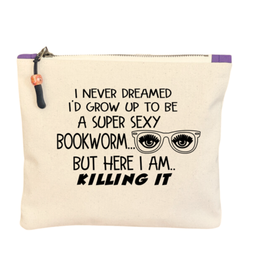 9x7 inch canvas bag with a zipper pull, watercolor paint swashes and the words, "I never dreamed I'd grow up to be a super sexy bookworm..but here I am..killing it."