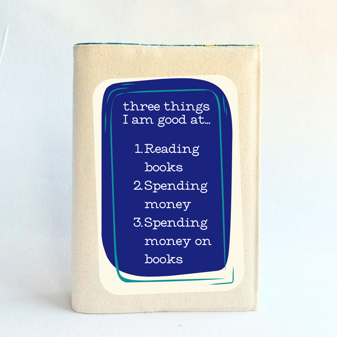 canvas book cover with a purple square and the words, three things I am good at - reading books, spending money, spending money on books.