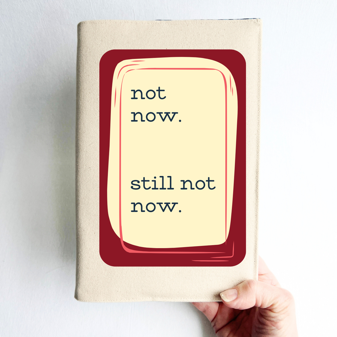 rectangular linen-colored canvas book cover with a deep red graphic square, topped iwth a cream rectangle and the words, 'not now. still. not now.'