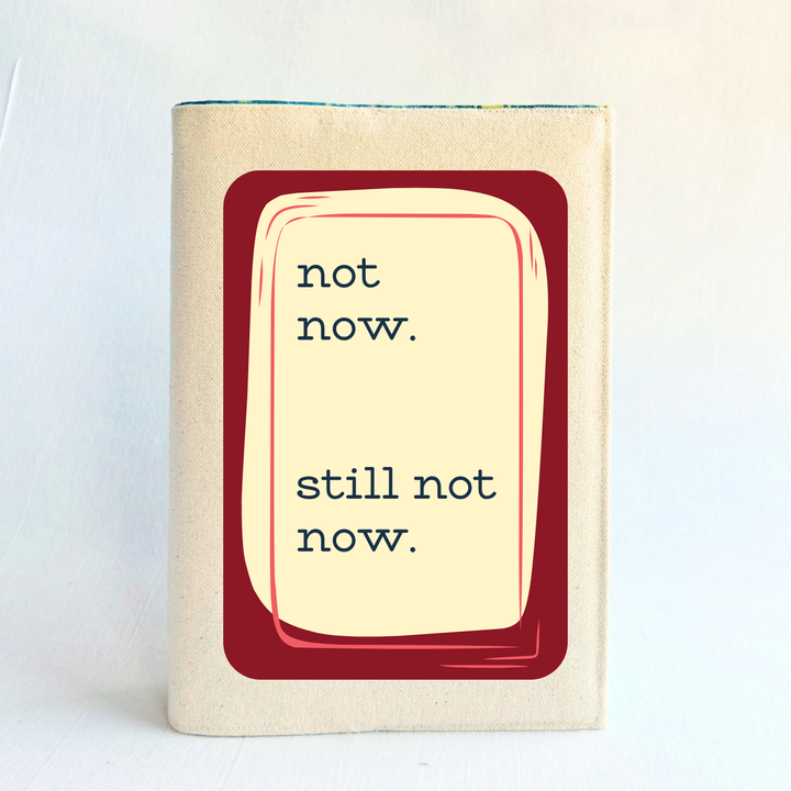 rectangular linen-colored canvas book cover with a deep red graphic square, topped iwth a cream rectangle and the words, 'not now. still. not now.'