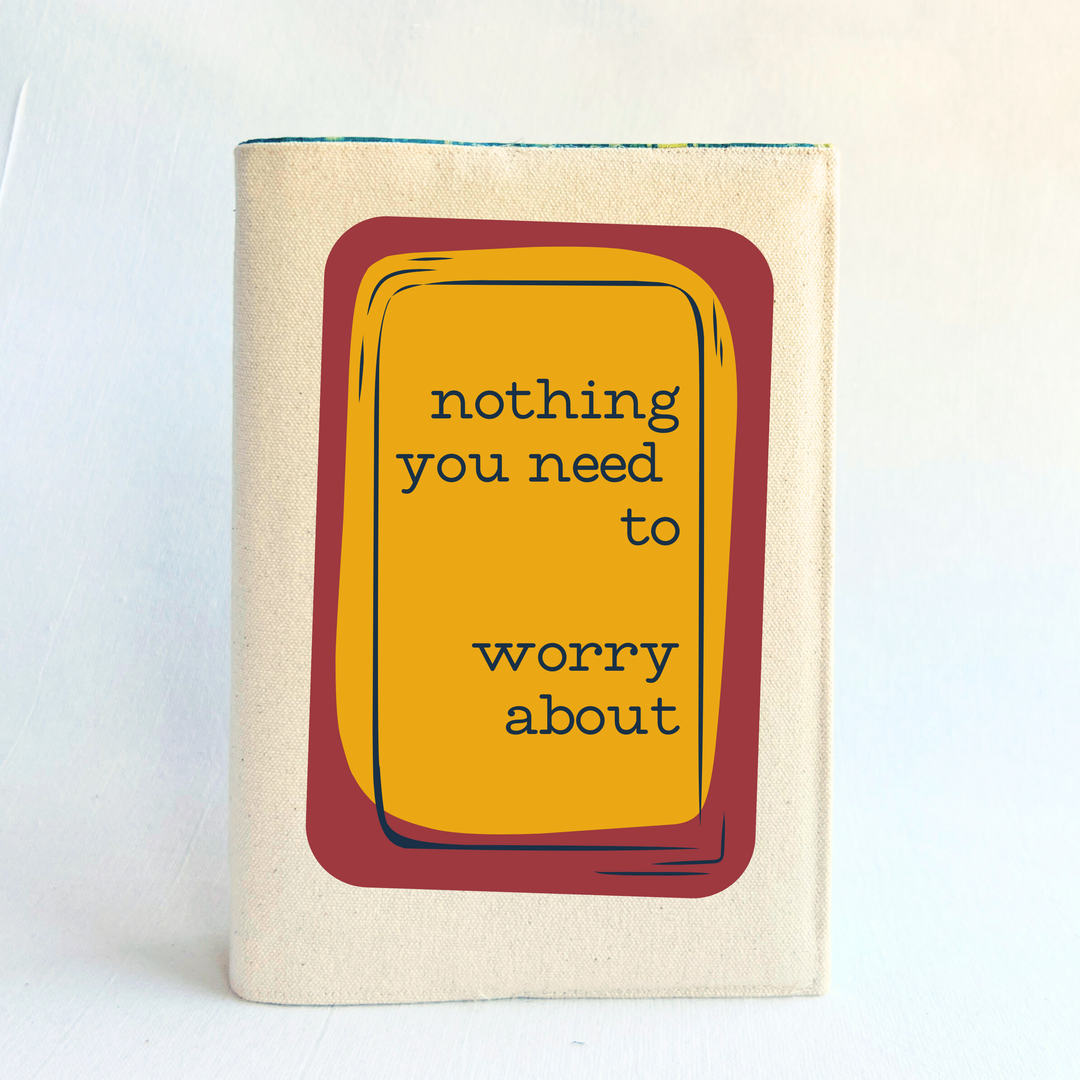 A linen-colored canvas book cover featuring a central graphic of a mustard yellow rounded rectangle with a dark red border and the text 'nothing you need to worry about' in black lettering.