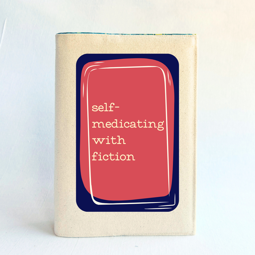 a rectangular linen-colored canvas book cover with a navy graphic topped by a rose square and the words, 'self-medicating with fiction' in white lettering