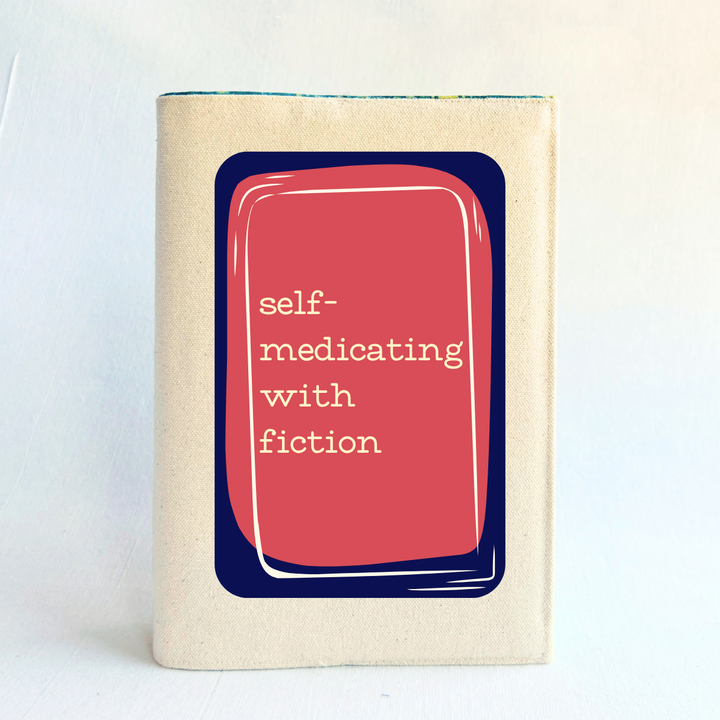 a rectangular linen-colored canvas book cover with a navy graphic topped by a rose square and the words, 'self-medicating with fiction' in white lettering