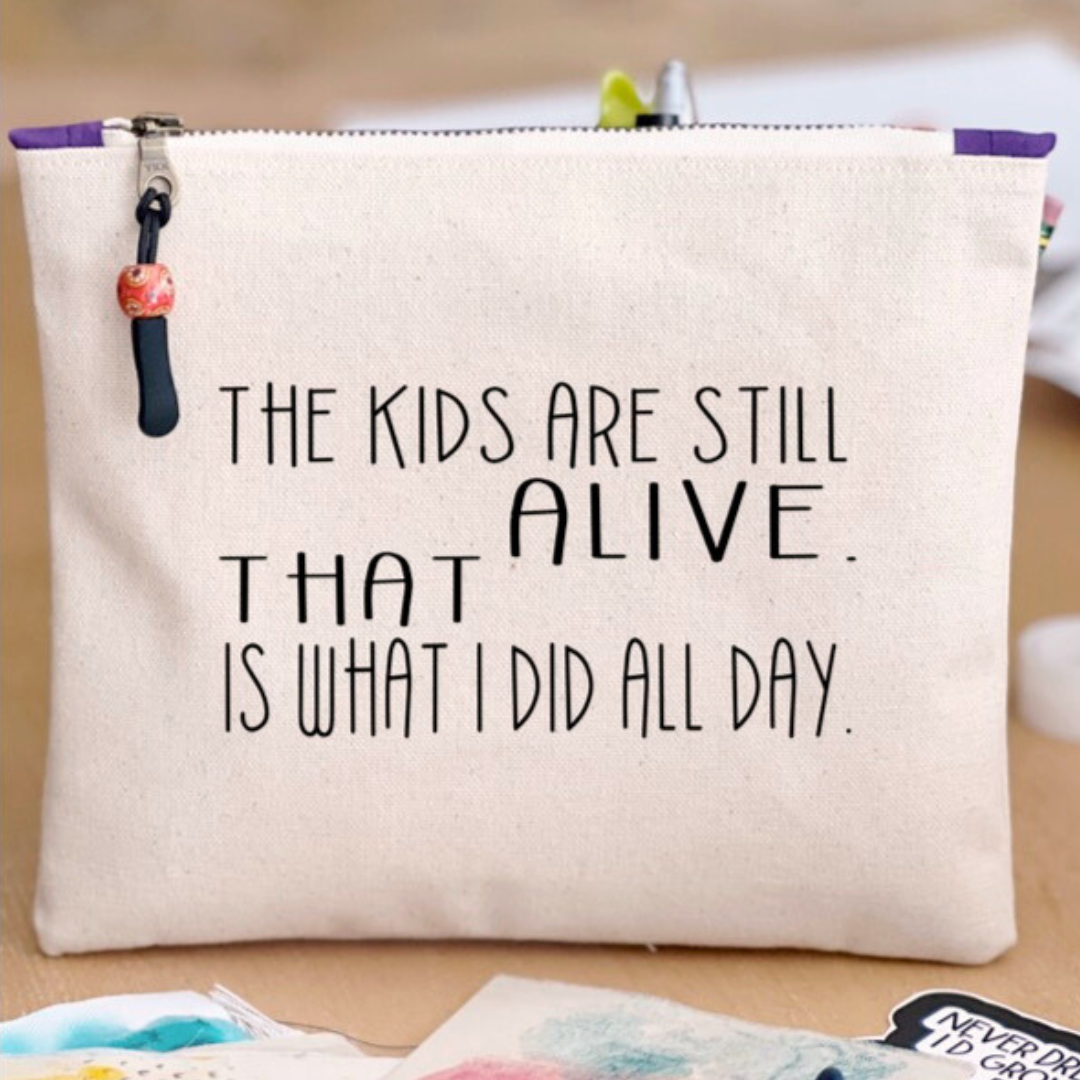 a square canvas zip bag with the words, "the kids are still alive. THAT is what I did all day." in black lettering
