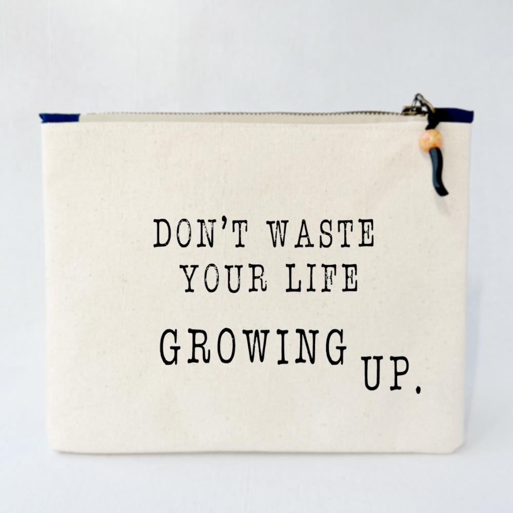 square canvas bag  with the words, don't waste your life growing up.