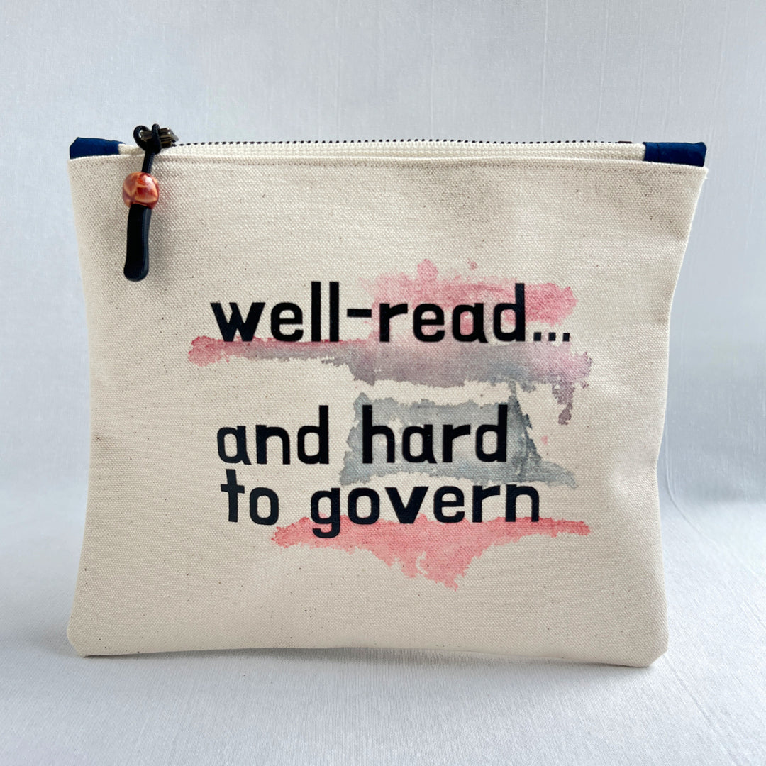A canvas zippered pouch with the text 'well-read.