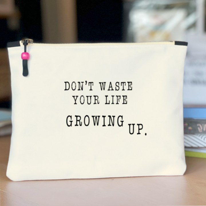 square canvas bag  with the words, don't waste your life growing up.