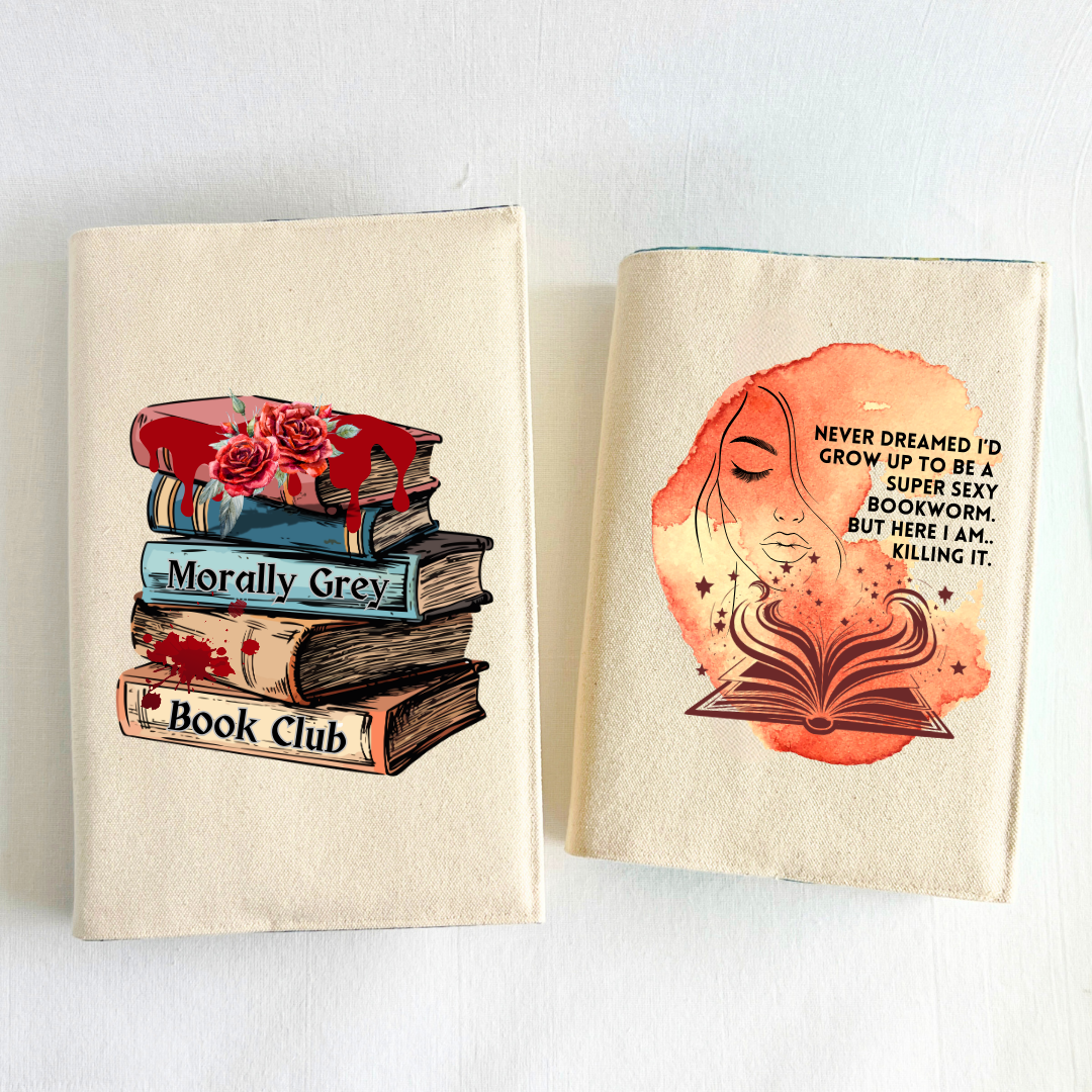 a book covered with a linen-colored canvas reusable book cover with a vibrant orange-yellow watercolor swash, featuring the outline of a face with long lashes and lush lips, an open book with stars and flourishes, and the words, 'never dreamed I'd grow up to be a super sexy bookworm. but here I am, killing it.'  A second book with a canvas cover and the design of a book stack with roses, blood drips and splatters and the words, 'Morally grey book club' are displayed as a combo purchase.