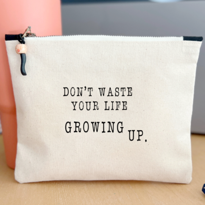 square canvas bag  with the words, don't waste your life growing up.