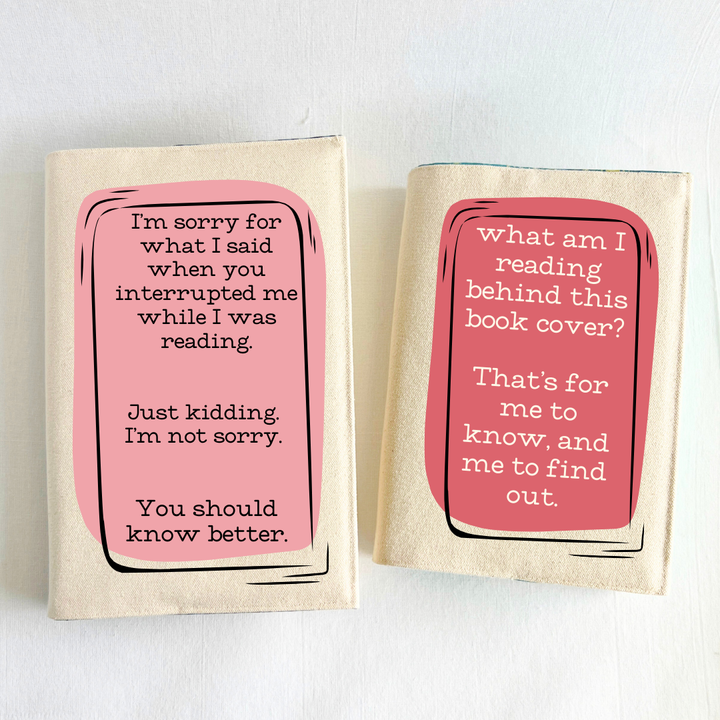  a sample of a combination, two books, both covered in reusable canvas book covers, with square designs in coral colors.  One cover reads, 'I'm sorry for what I said when you interrupted me while I was reading.  Just kidding.  I'm not sorry.  You should know better.  The second cover reads, 'What am I reading behind this book cover?  That's for me to know, and me to find out.'