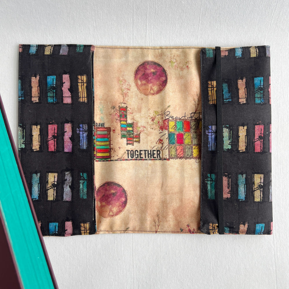 A resuable fabric book cover in multiple colors