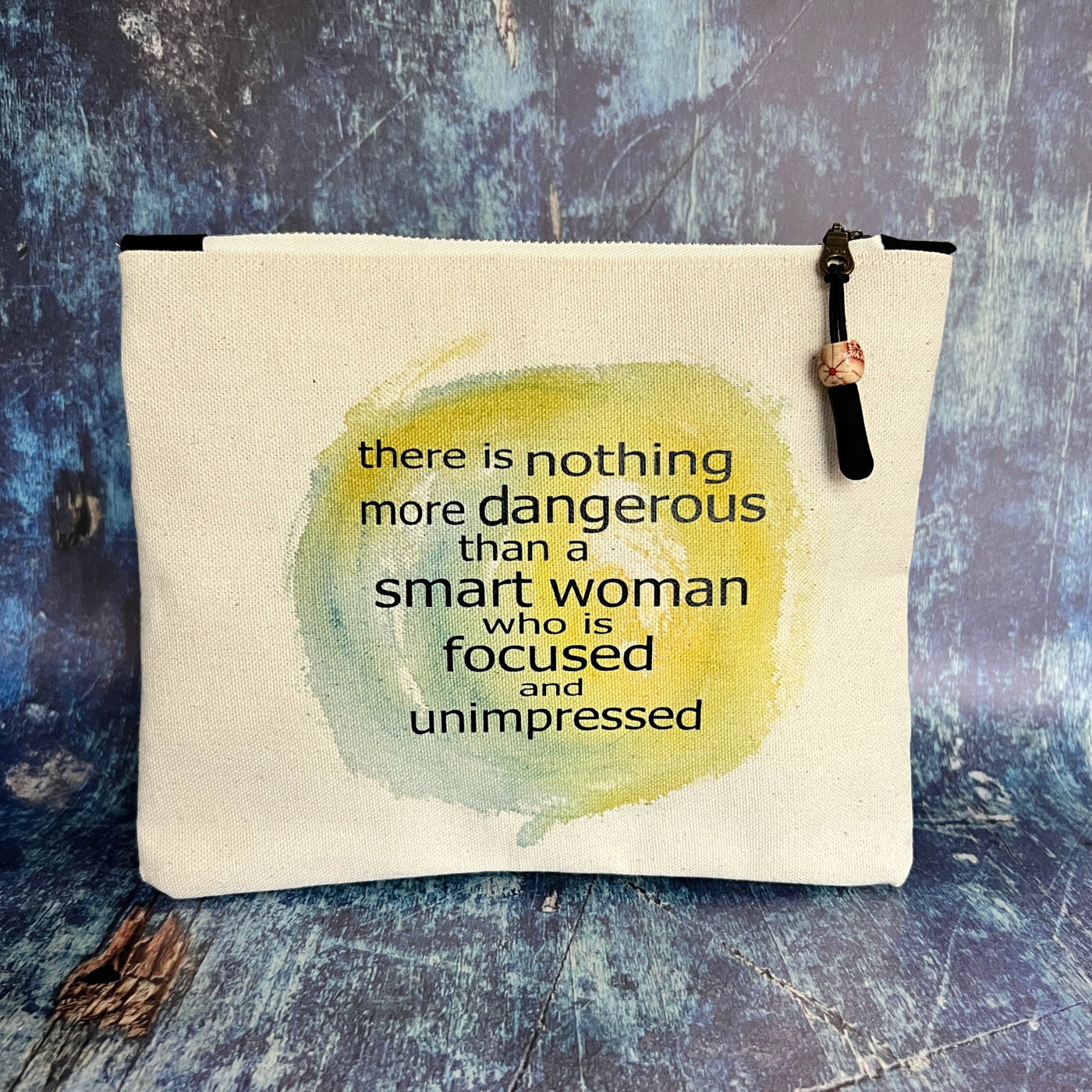 mini canvas zip bag - a smart woman is focused and unimpressed