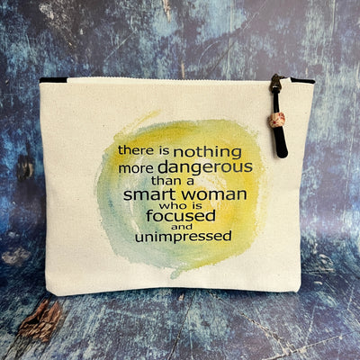mini canvas zip bag - a smart woman is focused and unimpressed