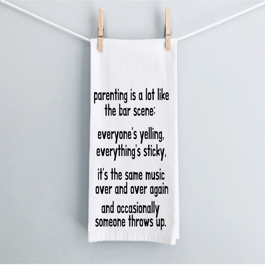 rectangular white kitchen towel with the words, parenting is lot like the bar scene: everyone's yelling, everything's sticky, it's the same music over and over again and occasionally someone throws up.