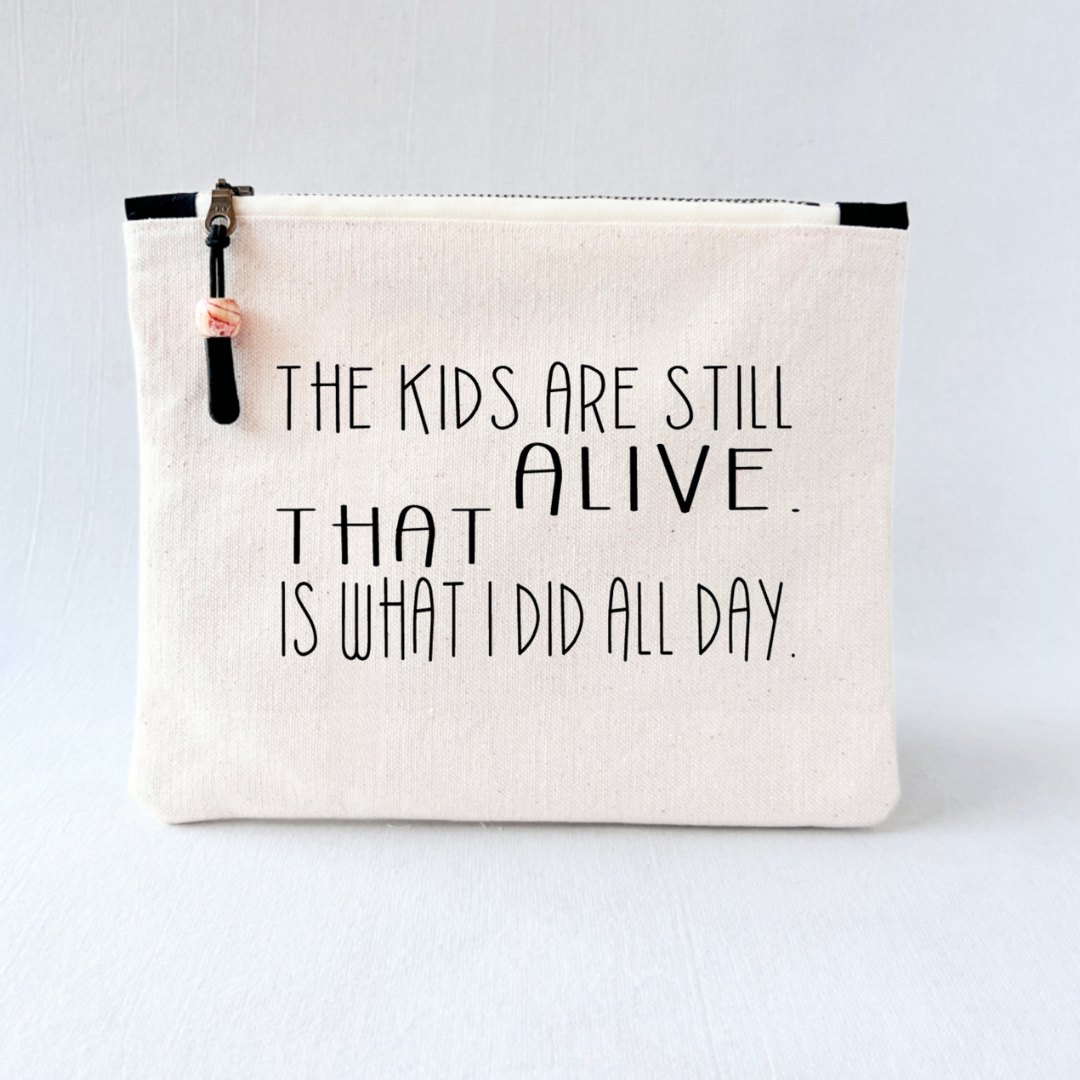 square canvas zipper pull bag with the words, the kids are still alive - that is what I did all day.