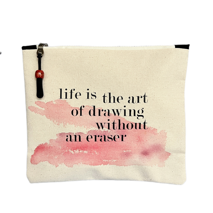 square canvas zipper pull bag with the words, life is the art of drawing without an eraser
