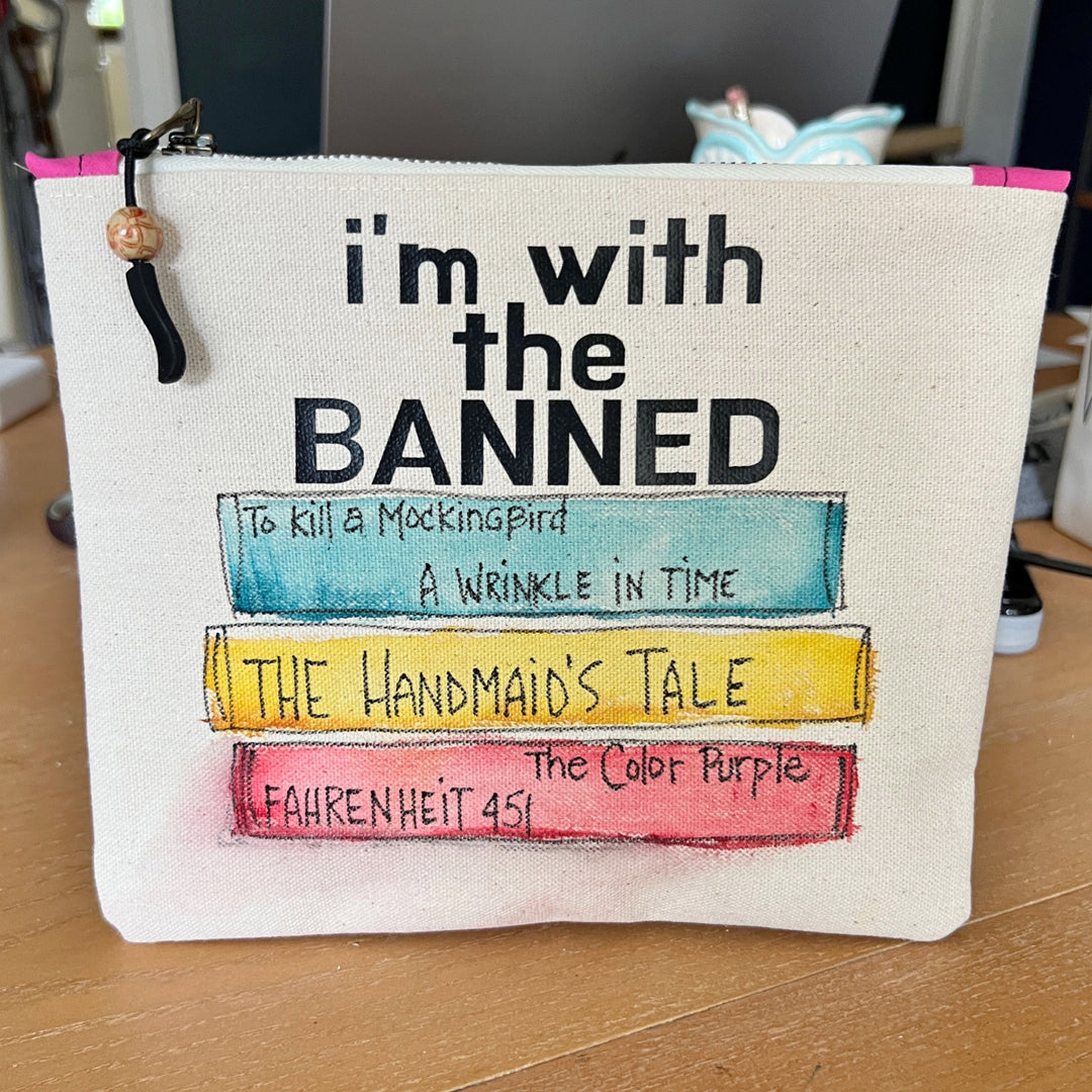 square canvas bag with painted books and the words, I'm with the Banned