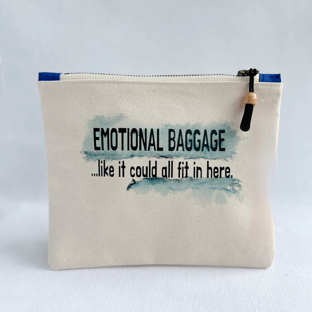 square canvas zip bag with the words, emotional baggage, like it could all fit in here. painted with swashes of blue