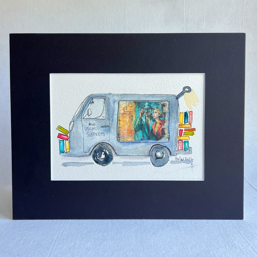 A matted watercolor painting of a grey-blue book truck named "The Usual Suspects" with books and a colorful window illustration, of a couple gazing mysteriously into the distance.