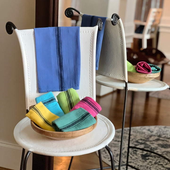 hand-dyed kitchen towels with herringbone flat weave pattern, in colors of yellow gold, lime green, blueberry, gumdrop pink, aqua velvet green and pool side teal. use as napkins, towels or placemats.