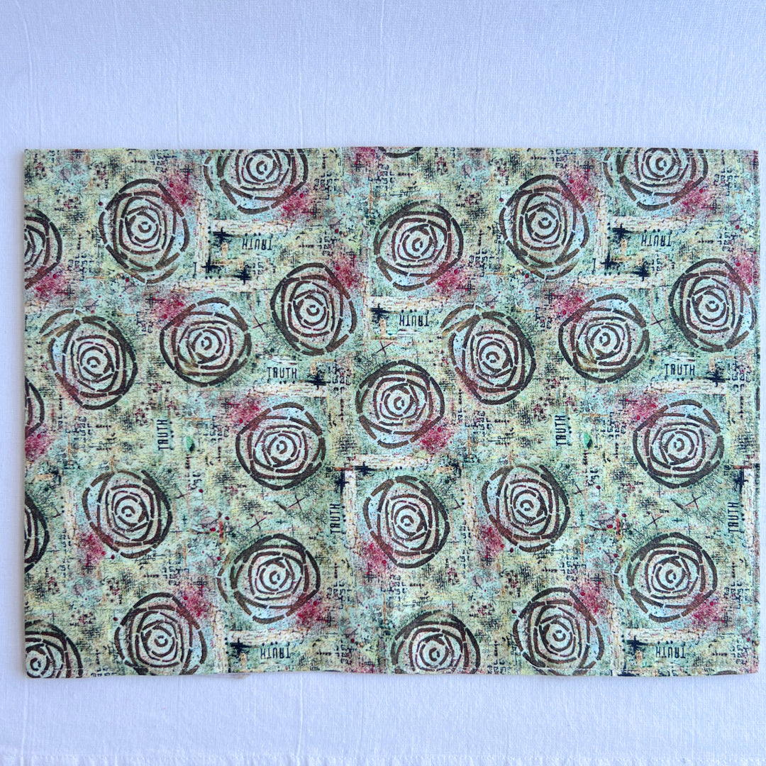 vibrant blue green fabric reusable  adjustable book cover.  Fabric has impressionist rose / concentric deep brown circles and the word ' TRUTH scattered on the pattern.