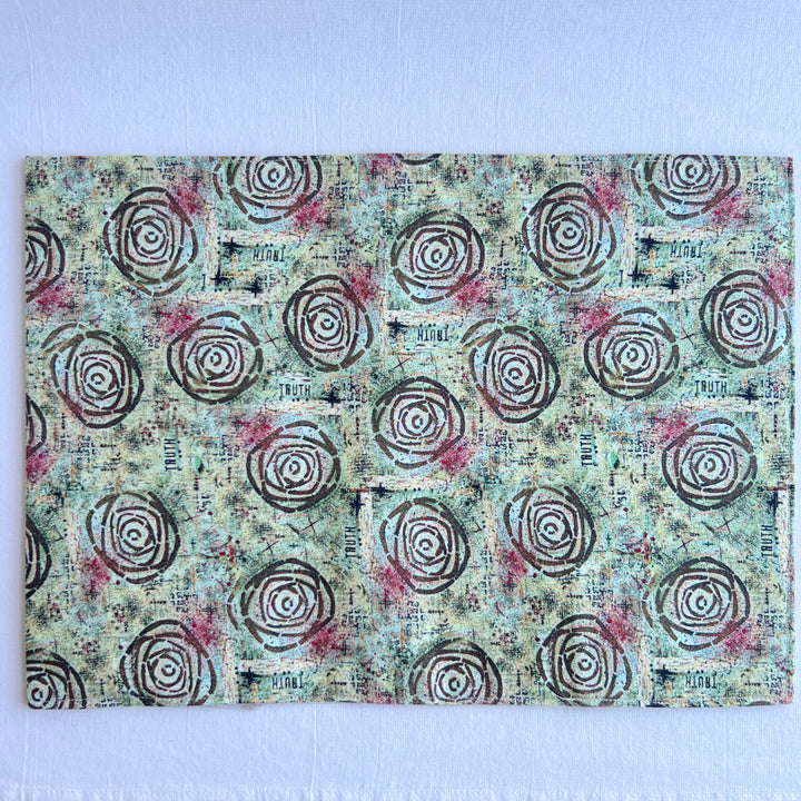 vibrant blue green fabric reusable  adjustable book cover.  Fabric has impressionist rose / concentric deep brown circles and the word ' TRUTH scattered on the pattern.