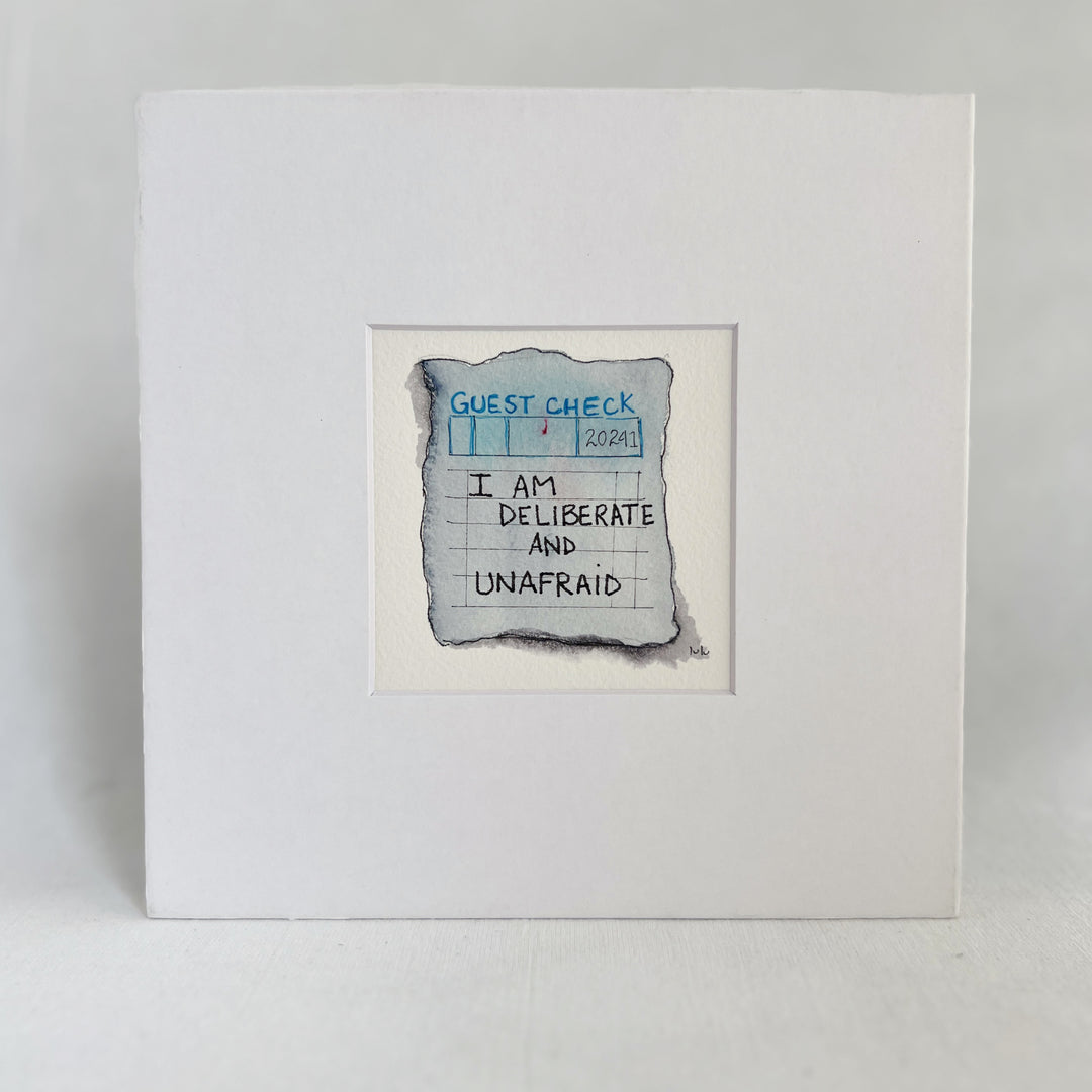 an original watercolor painting in shades of blue-grey, depicting a vintage crumpled diner guest check with the words,I am deliberate and unafraid, matted in white
