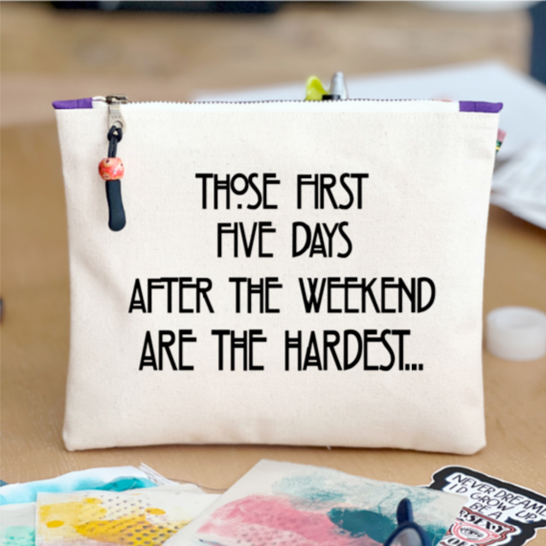 rectangular shaped canvas zip pouch in linen color, with a black zipper pull and the words, Those first five days after the weekend are the hardest in black lettering.