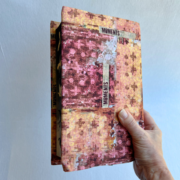A resuable fabric book cover in multiple colors