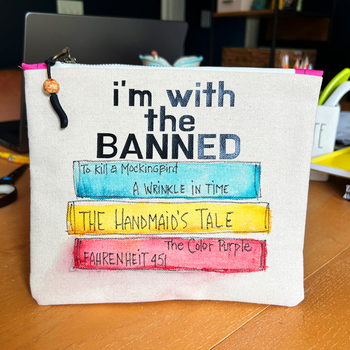 square canvas bag with painted books and the words, I'm with the Banned