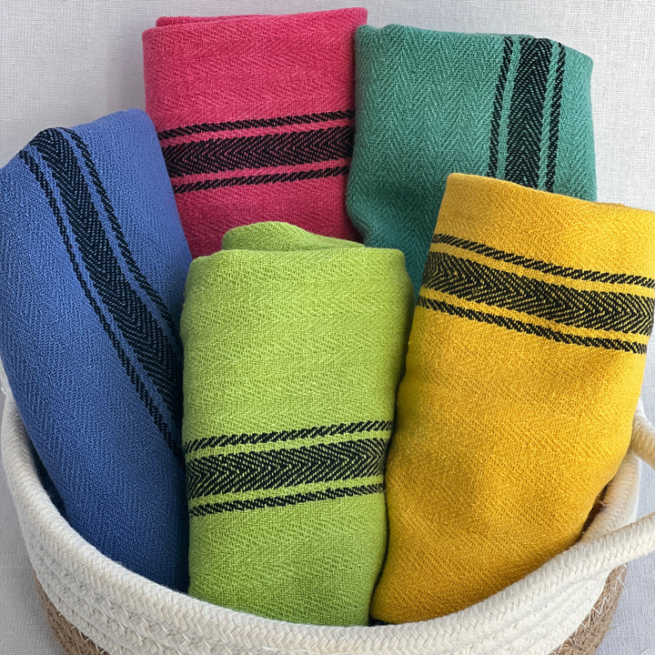 hand-dyed kitchen towels with herringbone flat weave pattern, in colors of yellow gold, lime green, blueberry, gumdrop pink, aqua velvet green and pool side teal. use as napkins, towels or placemats.