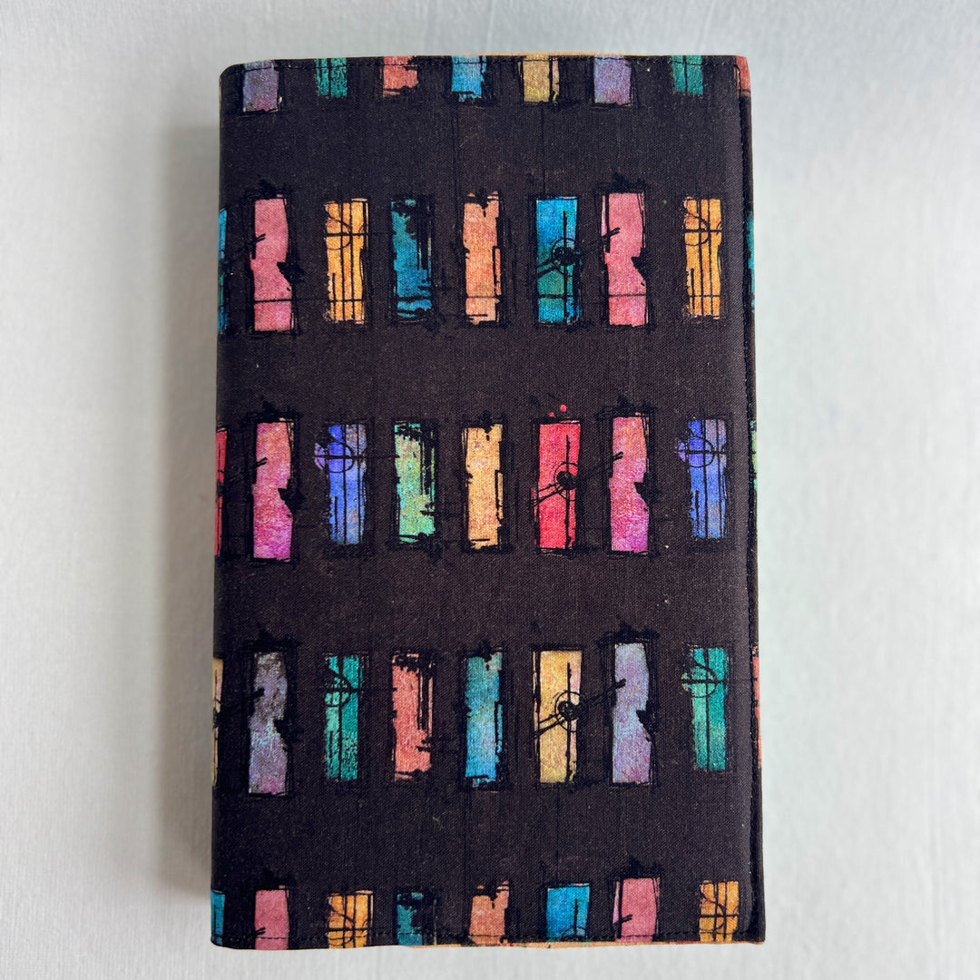 A resuable fabric book cover in multiple colors