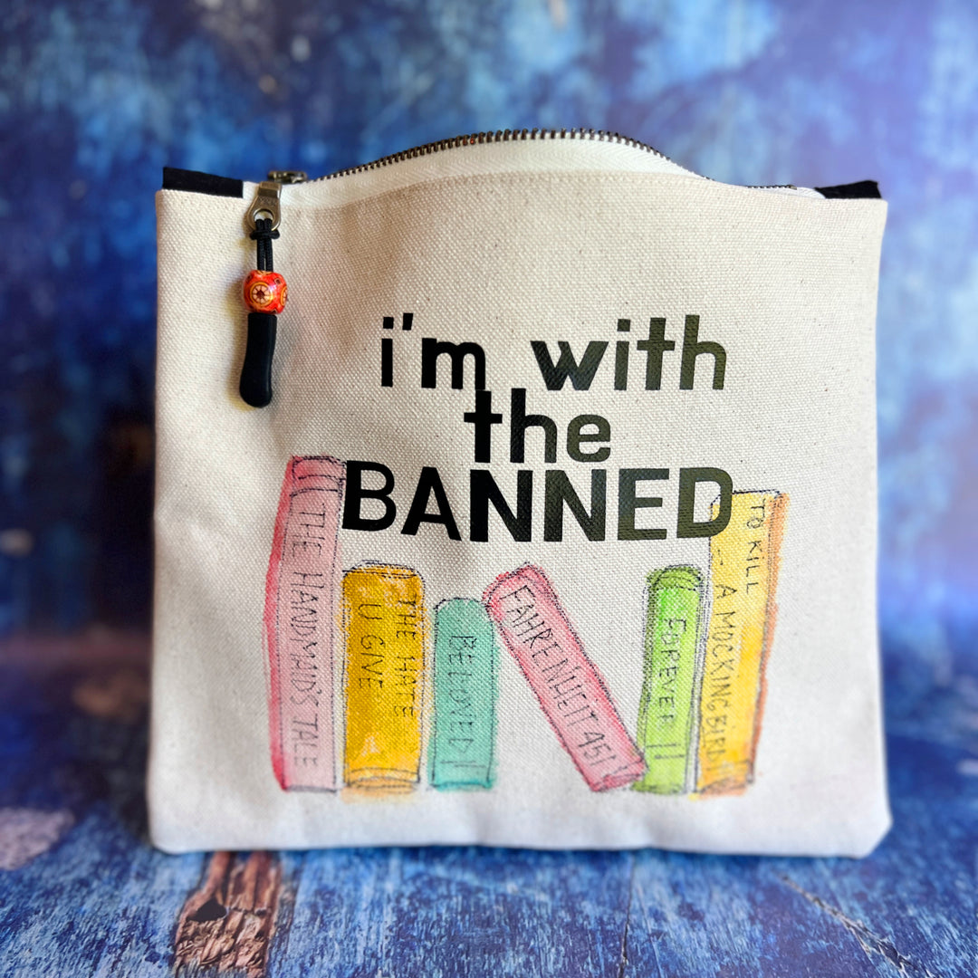 square canvas bag with painted books and the words, I'm with the Banned