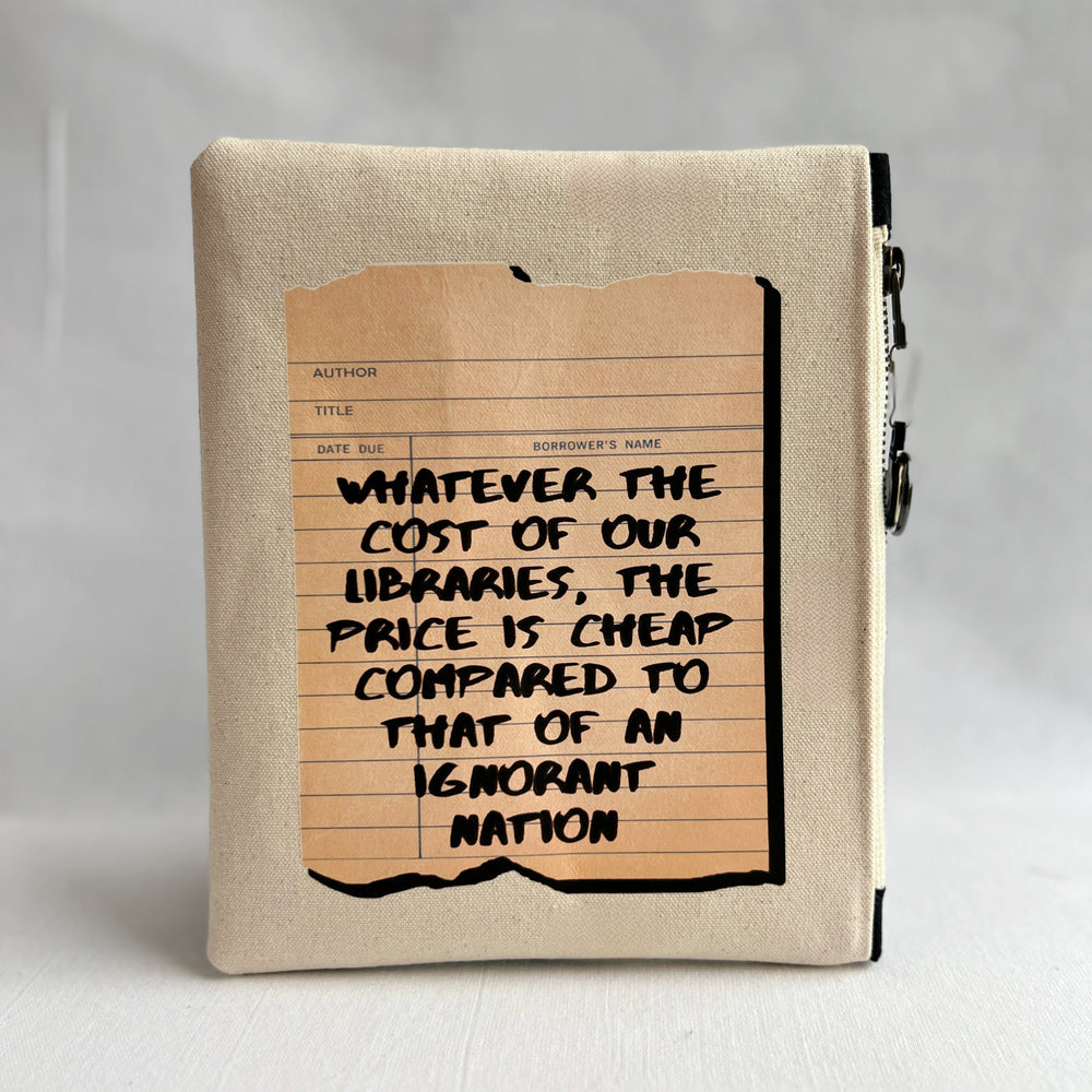 padded canvas zip bag with a linen library card and the words, whatever the cost of our libraries and bookstores, the prices is cheap compared to that of an ignorant nation, plus a colorful zipper pull and lining