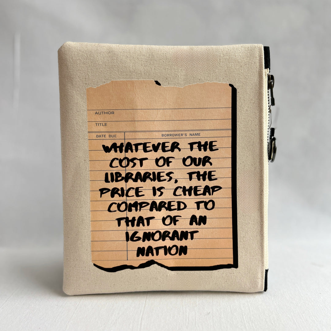 padded canvas zip bag with a linen library card and the words, whatever the cost of our libraries and bookstores, the prices is cheap compared to that of an ignorant nation, plus a colorful zipper pull and lining