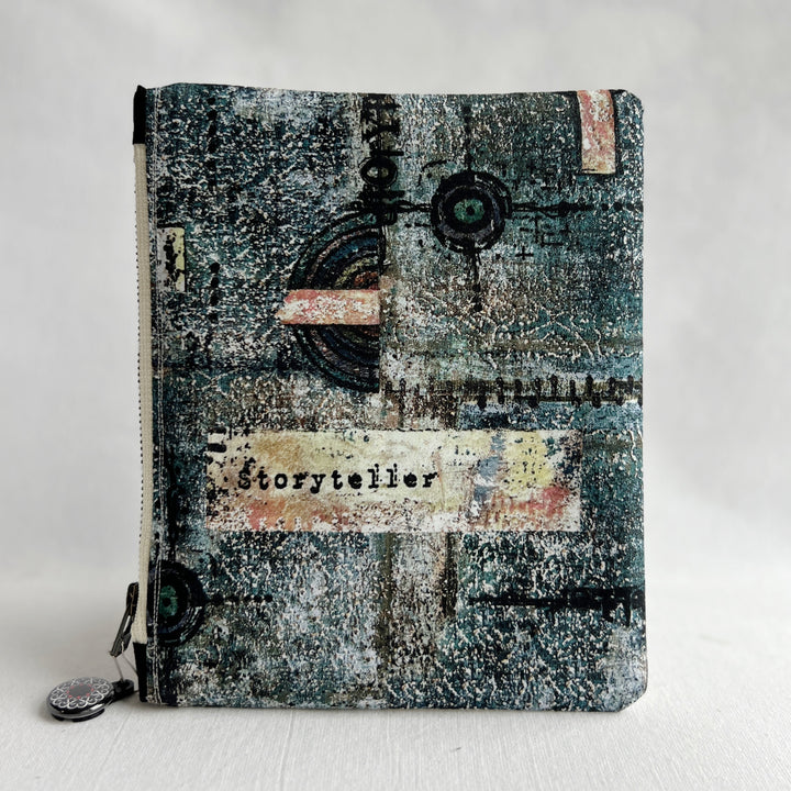 padded canvas zip bag with a blue  library card and the words, Fantasy Tales are not meant to tell us that monsters exist, but that they can be slayed, plus a colorful zipper pull and lining