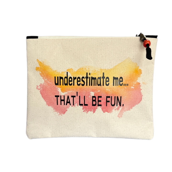 a canvas zip bag with watercolor paints and the words, "underestimate me, that'll be fun" in black lettering