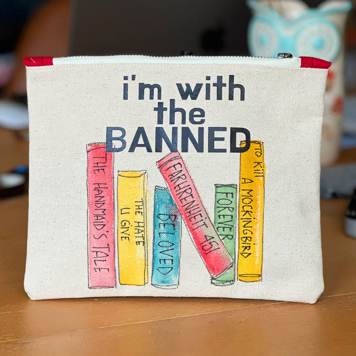 square canvas bag with painted books and the words, I'm with the Banned