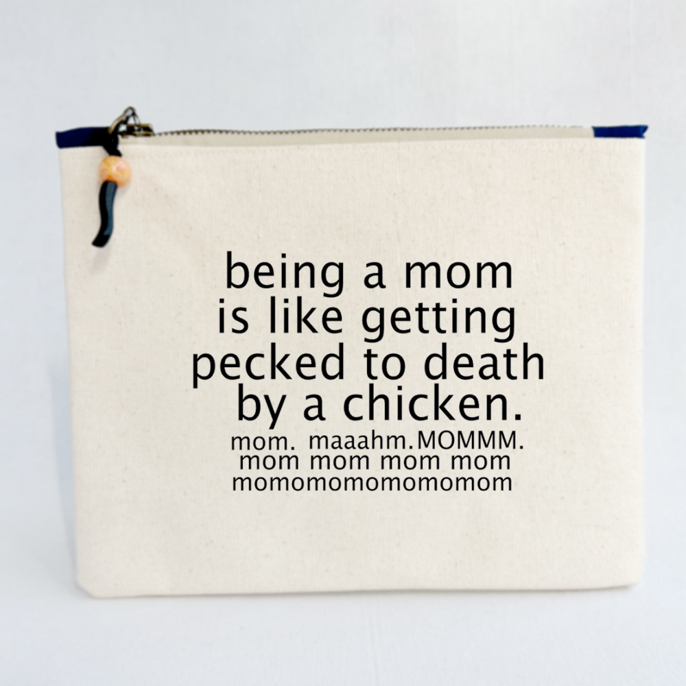 a square canvas zip bag with the words, being a mom is like getting pecked to death by a chicken.