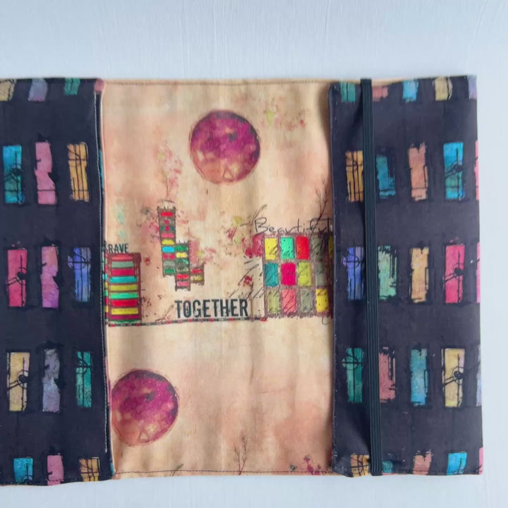 A resuable fabric book cover in multiple colors