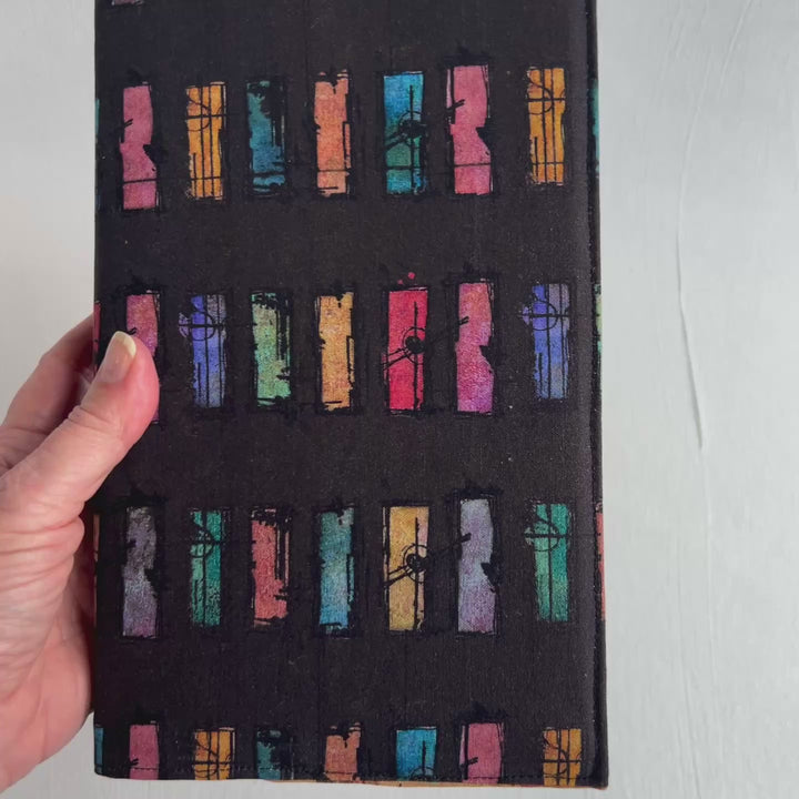 A resuable fabric book cover in multiple colors