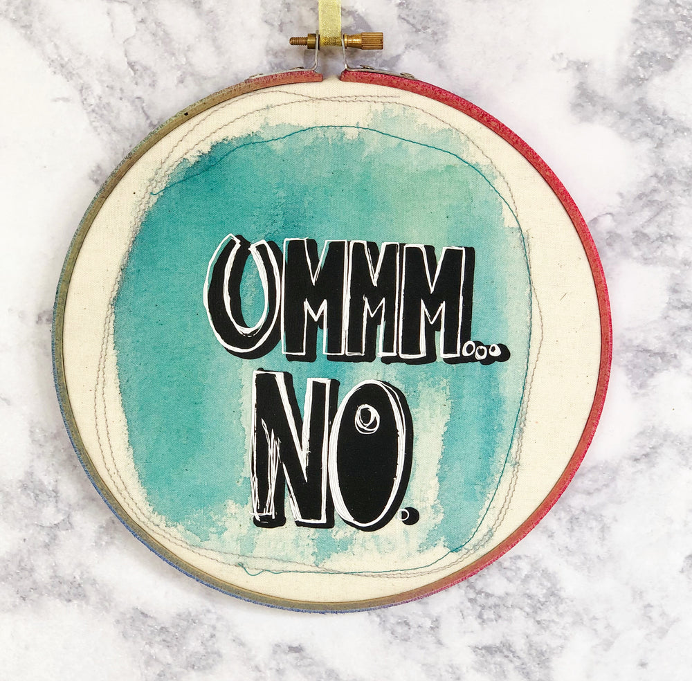 round wooden hoop with blue paint and the words, "ummm...no."