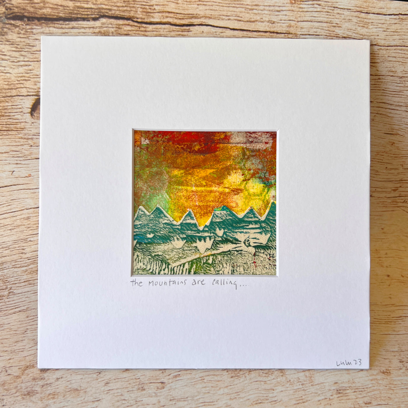 the mountains are calling in this original pretty clever fabric art print with yellows, greens and reds