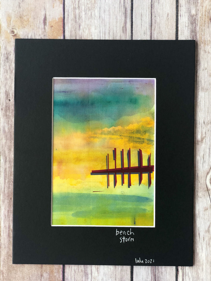 fabric art piece with blues, greens and purple paints, layered with a vinyl depicting a pier
