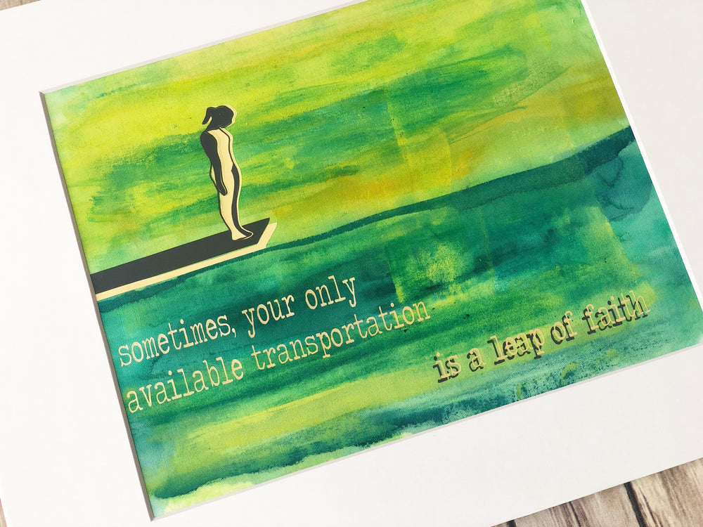 painted fabric art piece in green and blue paint, with a person on a diving board, and the words, "sometimes your only available transportation is a leap of faith