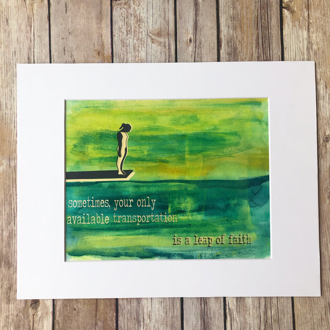 painted fabric art piece in green and blue paint, with a person on a diving board, and the words, "sometimes your only available transportation is a leap of faith