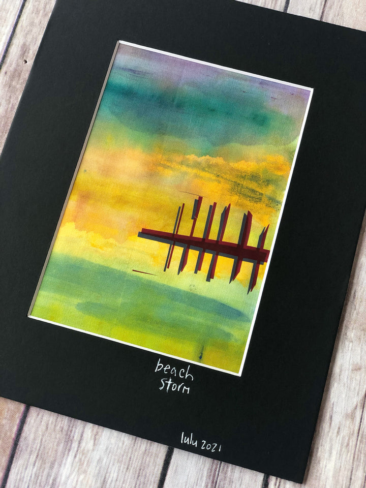 fabric art piece with blues, greens and purple paints, layered with a vinyl depicting a pier